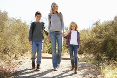 Mother And Children Hiking In Countryside stock photo Mother And Children Hiking In Countryside stock photo