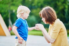 Mother comforting her son after he injured his hand Royalty Free Stock Photo Mother comforting her son after he injured his hand Royalty Free Stock Photo