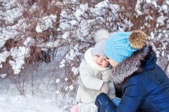 Mother and daughter hugging in the winter. stock images Mother and daughter hugging in the winter. stock images