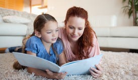 Mother and daughter looking at a magazine Royalty Free Stock Photo Mother and daughter looking at a magazine Royalty Free Stock Photo