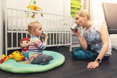 Mother and daughter playing with tin can phone at home royalty free stock photos Mother and daughter playing with tin can phone at home royalty free stock photos