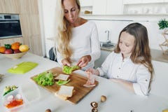 Mother daughter preparing school lunch home kitchen stock images Mother daughter preparing school lunch home kitchen stock images