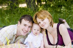 Mother, Father And Little Child Stock Photo
