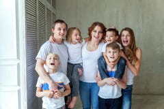 Mother, father and five children near at home stock photo Mother, father and five children near at home stock photo