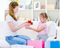 Mother giving a gift for her daughter royalty free stock photos Mother giving a gift for her daughter royalty free stock photos