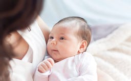 Mother with her newborn baby. Mother is holding her little baby Stock Photo Mother with her newborn baby. Mother is holding her little baby Stock Photo