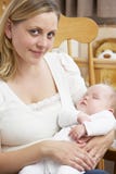 Mother Holding Baby In Nursery stock photos Mother Holding Baby In Nursery stock photos