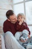 Dad and mom with a little daughter. Family in home clothes. stock images Dad and mom with a little daughter. Family in home clothes. stock images