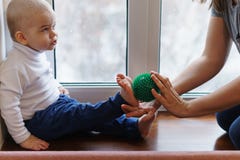 Mother makes foot massage to child stock images Mother makes foot massage to child stock images