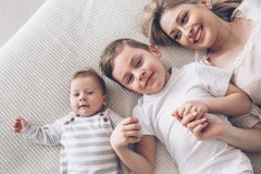Mother playing with her 2 children stock photo Mother playing with her 2 children stock photo