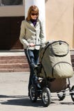 Mother With Baby Carriage Royalty Free Stock Image