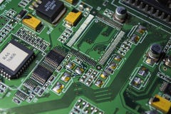The motherboard of green color from the personal computer. Repair. Texture or background. Electronics. Spare parts. stock photography The motherboard of green color from the personal computer. Repair. Texture or background. Electronics. Spare parts. stock photography