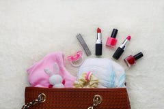 Mothers handbag with items to care for child royalty free stock photo Mothers handbag with items to care for child royalty free stock photo