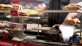 Motion of barista taking food for customer