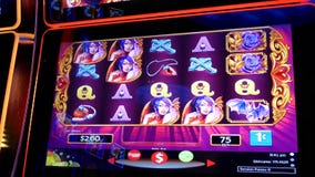 Motion of people playing slot machine inside Casino