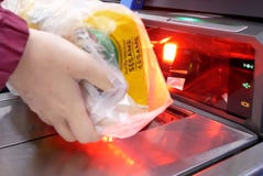 Motion of woman scanning food at self-check out counter Royalty Free Stock Images Motion of woman scanning food at self-check out counter Royalty Free Stock Images