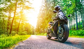 Motorbike on the road riding. having fun riding the empty road o Royalty Free Stock Image Motorbike on the road riding. having fun riding the empty road o Royalty Free Stock Image