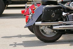 Motorcycle details. Two bikes in a parking lot stock photo Motorcycle details. Two bikes in a parking lot stock photo