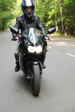Motorcyclist goes on road royalty free stock photography Motorcyclist goes on road royalty free stock photography