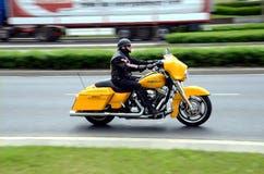 Motorcyclist On Yellow Bike Stock Photography