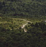 Faraway shot of a winding road through the countryside stock photo Faraway shot of a winding road through the countryside stock photo