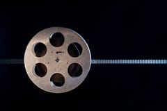 Movie film reel on dark Royalty Free Stock Images Movie film reel on dark Royalty Free Stock Images