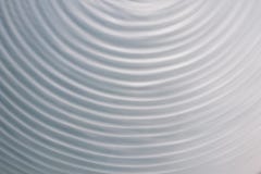 Movimiento de onda circular en un sistema flúido fondo del gris azul para imágenes de archivo libres de regalías Movimiento de onda circular en un sistema flúido fondo del gris azul para imágenes de archivo libres de regalías
