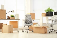 Moving Boxes And Furniture Stock Images