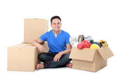 Moving day. man with cardboard box stock photos Moving day. man with cardboard box stock photos
