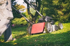 Mowing the grass with a lawn mower Stock Image Mowing the grass with a lawn mower Stock Image