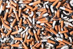 Muchos topes de cigarrillo Imágenes de archivo libres de regalías Muchos topes de cigarrillo Imágenes de archivo libres de regalías