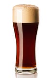 Mug of frosty dark beer with foam isolated on a white background royalty free stock image Mug of frosty dark beer with foam isolated on a white background royalty free stock image