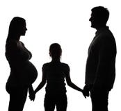 Mujer embarazada con la hija y el marido imagenes de archivo Mujer embarazada con la hija y el marido imagenes de archivo
