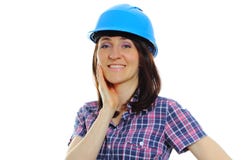 Mujer sonriente del constructor que lleva el casco azul protector Foto de archivo libre de regalías Mujer sonriente del constructor que lleva el casco azul protector Foto de archivo libre de regalías