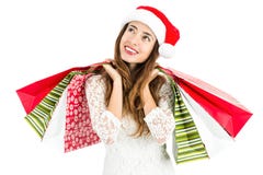 Mulher do Natal com os sacos de compras que olham para copiar o espaço imagem de stock royalty free Mulher do Natal com os sacos de compras que olham para copiar o espaço imagem de stock royalty free