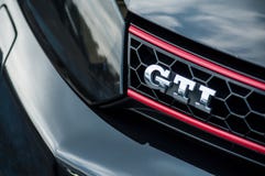 Closeup of GTI sign on black Volkswagen Golf GTI front parked in the street