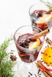Mulled wine with orange slices on white - winter warming drink royalty free stock image Mulled wine with orange slices on white - winter warming drink royalty free stock image