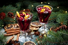 Mulled wine with orange  and spices in glass