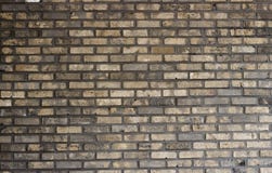 Multi-colored brick wall close-up, texture, uneven surface, background royalty free stock photography Multi-colored brick wall close-up, texture, uneven surface, background royalty free stock photography
