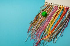 Multi-colored threads for embroidery homemade stock photos Multi-colored threads for embroidery homemade stock photos