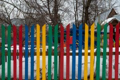 Multi colored wooden fence in the country stock photo Multi colored wooden fence in the country stock photo