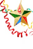 Multi-coloured Celebratory Tinsel And Christmas Star On A White Royalty Free Stock Photography
