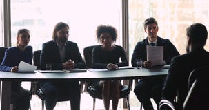Multi ethnic employers team making hiring decision at job interview