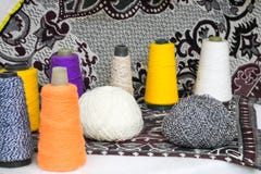 Multicolored bright beautiful yarn, artificial acrylic fiber threads, reel of thread for sewing, making clothes royalty free stock photography Multicolored bright beautiful yarn, artificial acrylic fiber threads, reel of thread for sewing, making clothes royalty free stock photography