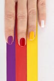 Multicolored bright saturated manicure on short nails close-up. royalty free stock photo Multicolored bright saturated manicure on short nails close-up. royalty free stock photo