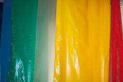 Multicolored colored bright motley rolls of plastic film. Chemical production, high-pressure polyethylene royalty free stock photo Multicolored colored bright motley rolls of plastic film. Chemical production, high-pressure polyethylene royalty free stock photo