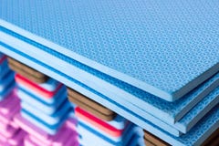 Multicolored EVA Foam puzzle mats stacked stock photos Multicolored EVA Foam puzzle mats stacked stock photos