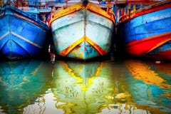 Multicolored Old Boat In The Fishing Port. Colored Reflections In The Water. Sri Lanka. Tangalle. Royalty Free Stock Image