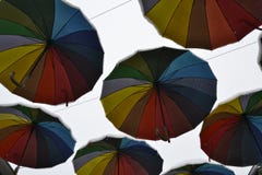 Multicolored rainbow umbrellas in the sky covered with snow stock photography Multicolored rainbow umbrellas in the sky covered with snow stock photography