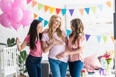 multicultural women touching pregnant friend belly stock images multicultural women touching pregnant friend belly stock images
